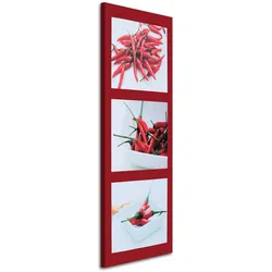WANDBILD rote chilischoten auf rotem hintergrund