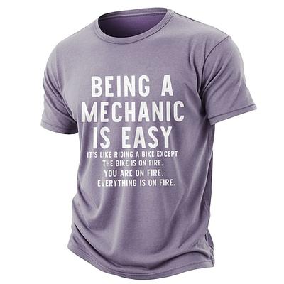 Mechaniker zu sein ist einfach, es ist wie Fahrradfahren, nur dass das Fahrrad brennt, du brennst, alles brennt. Lustiges Mechaniker-T-Shirt aus gewaschener, abgenutzter Baumwollmischung,