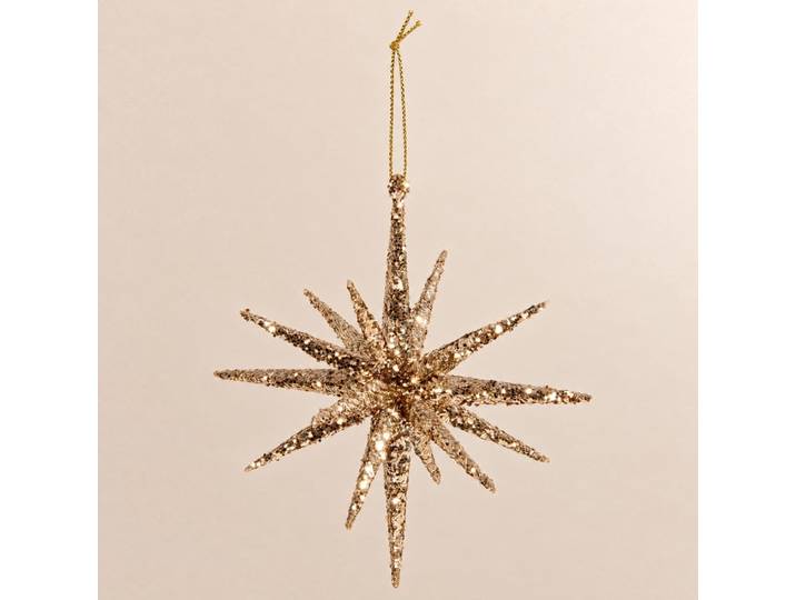Weihnachtsschmuck mit glitzerndem Goldstern