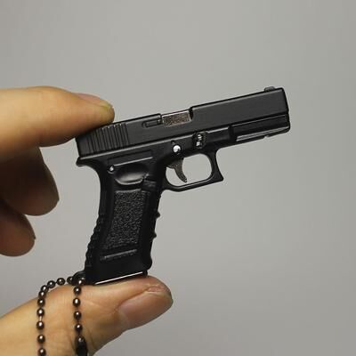 The Handy Homestead Mini Pistol Keychain Toy With Removable Magazine & Collectible Charm black