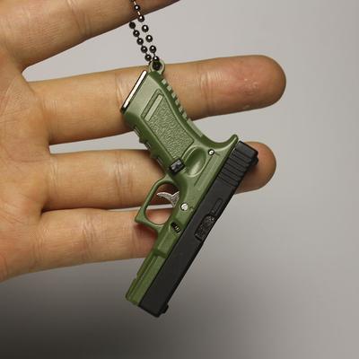 The Handy Homestead Mini Pistol Keychain Toy With Removable Magazine & Collectible Charm green