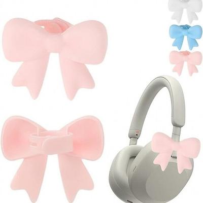 Silikon-Schleifen-Kopfhöreraccessoire, 2er-Pack 3D-Schleifen-Dekoration für Kopfhörer, niedliche Ohrhörer-Verzierungen, kokette Silikon-Schleifen-Kopfhörerclip-Dekorations-Befestigungsaccessoires für