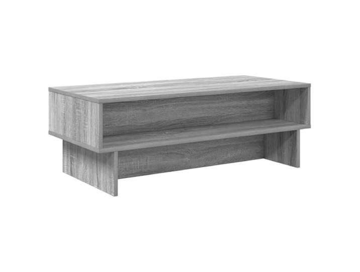 Xhnifbn Couchtisch Graues Sonoma 100x46x35 cm Holzwerkstoff mit 2 Fächern Rechteckiger Wohnzimmertisch in grauem Sonoma-Dekor mit doppelter Ablagefläche für Zeitschriften und Fernbedienungen.