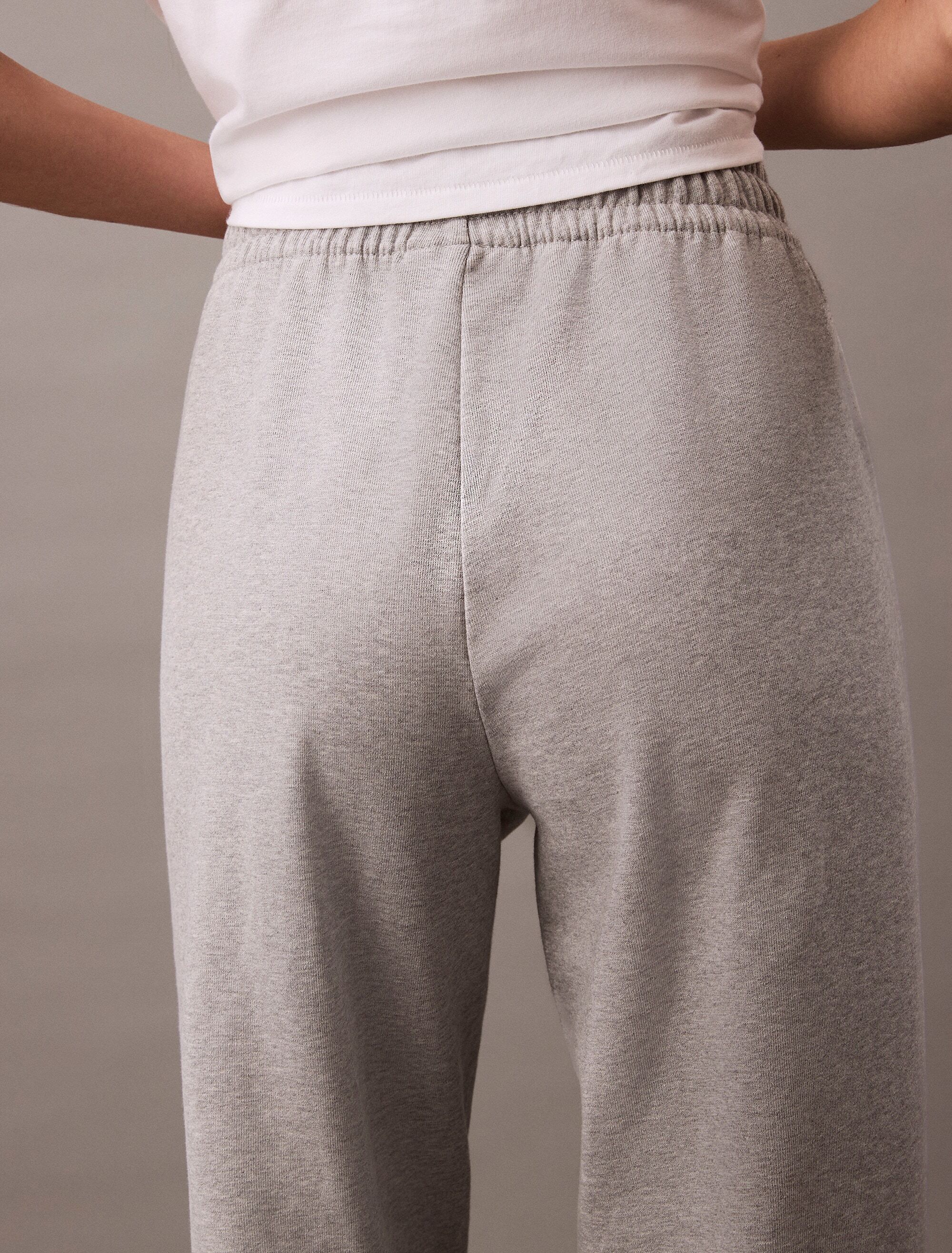 Sweathose CALVIN KLEIN "MONOLOGO FRENCH TERRY JOGGER", Damen, Gr. XXS (34), N-Gr, grau (heroic grau heather), Jersey, Obermaterial: 86% Baumwolle, 14% Polyester, meliert, bequem lang, Hosen Sweathose heroic grau heather XXS (34), N-Gr