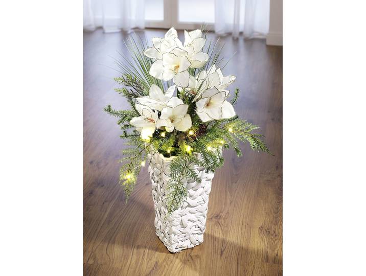 Beleuchtetes Amaryllis-Gesteck in Vase