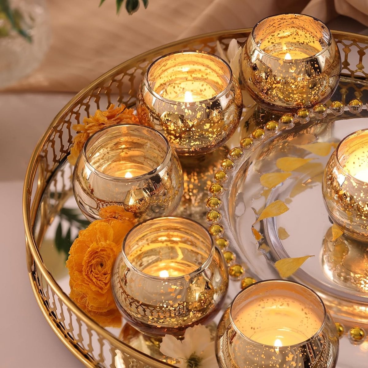 Set van 12 gouden waxinelichthouders met mercuryglaaseffect voor sfeervolle decoratie