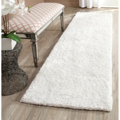 SAFAVIEH Handmade South Beach Leonella Shag Solid Polyester Rug