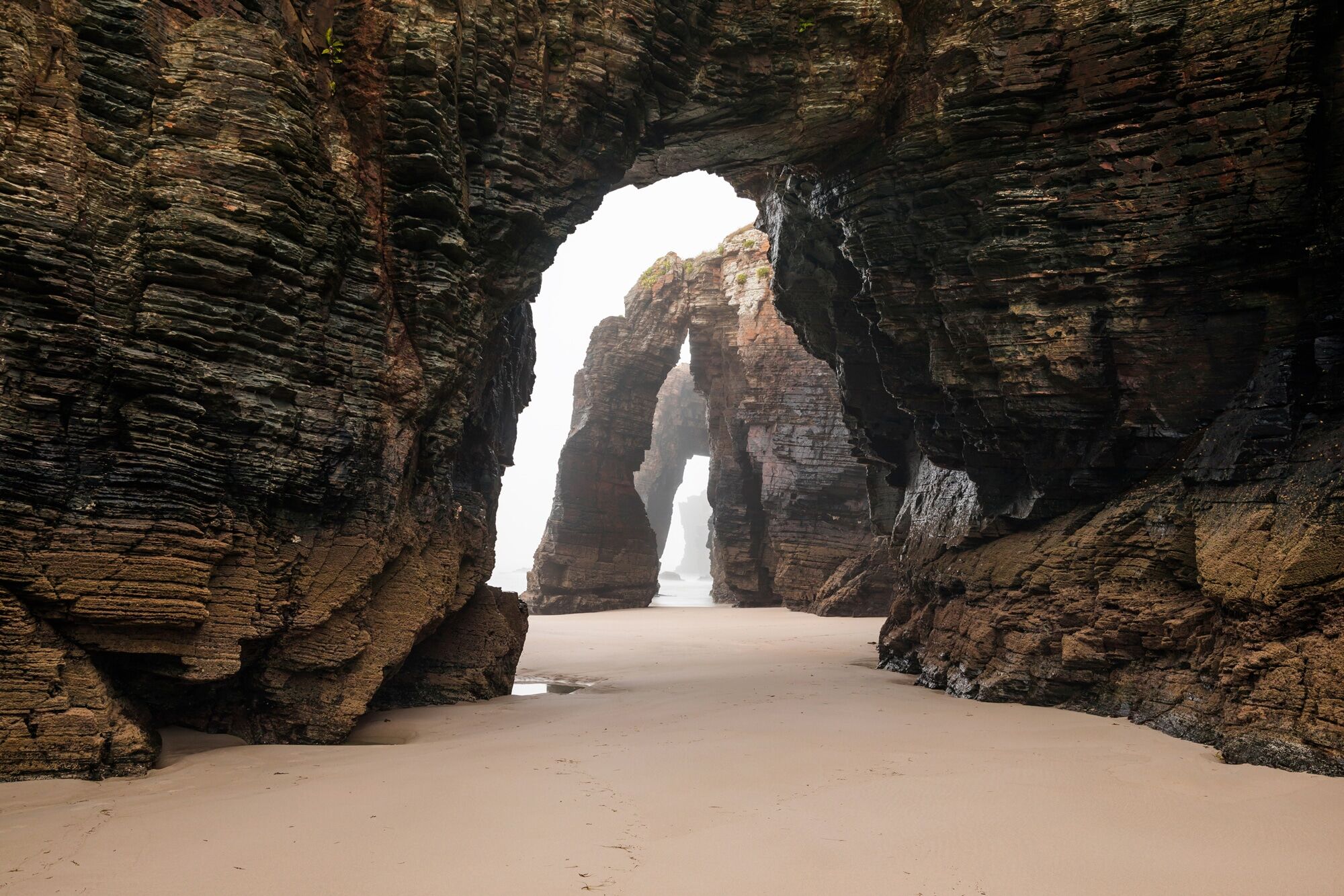 Fototapete PAPERMOON "GROTTE-FELSEN EBBE SPANIEN TUNNEL STRAND DUNEN MEER", bunt, B:5m L:2,8m, Vlies, Tapeten, Fototapete bunt B/L: 5m x 2,8m, Bahnen: 10 Stk.