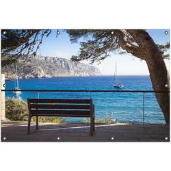 Wallario Gartenposter ca. 120 x 180 cm Einsame Bank am Meer - Spanien im Sommer