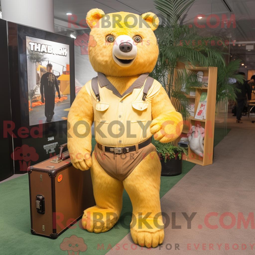 Maskottchen REDBROKOLY eines goldenen Faultierbären mit Schlagjeans und Aktentasche