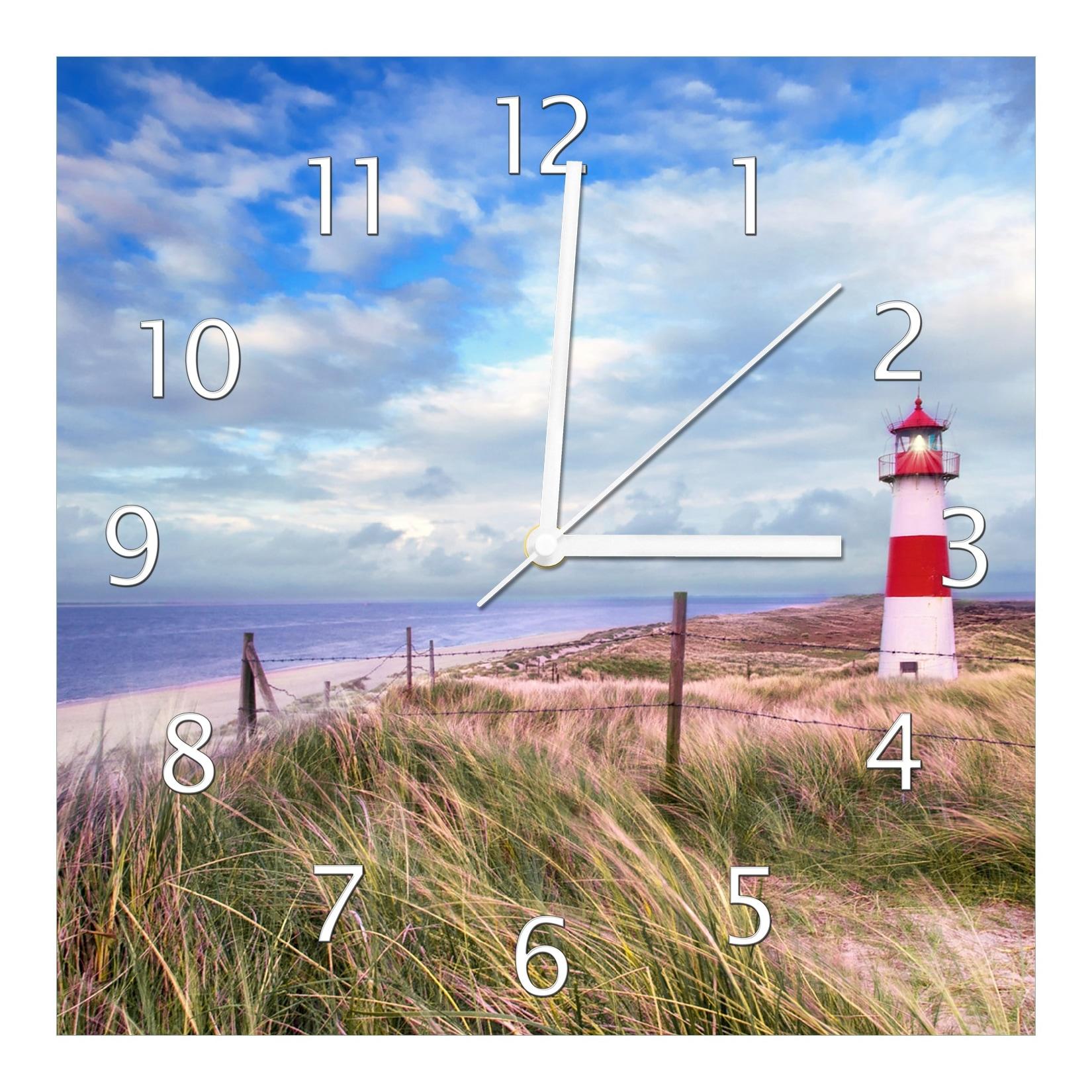Wallario Uhr 30 x 60 cm, schwarze Zeiger Leuchtturm am Strand von Sylt
