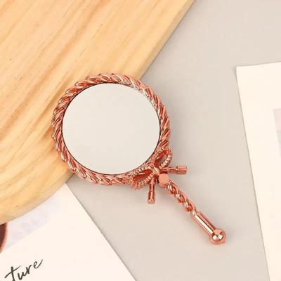 Uplift Picks Elegant Round Handheld Makeup Mirror For Portable Beauty And Grooming Use rose Gold