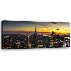 WANDBILD stadt vor dem hintergrund der untergehenden sonne