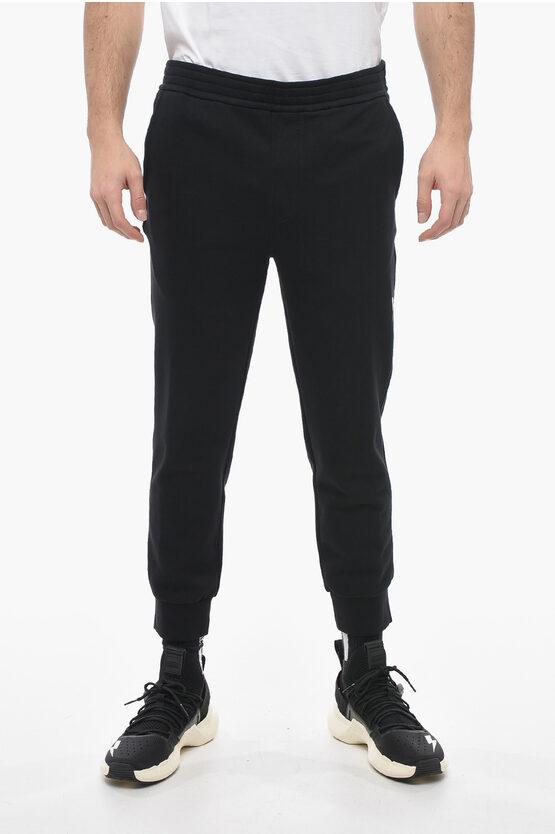 Skinny Fit Sweatpants aus Baumwolle mit Bündchen in Schwarz