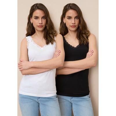Spitzentop TAMARIS, Damen, Gr. 42, schwarz-weiß (schwarz, weiß), Single Jersey, Obermaterial: 95% Baumwolle, 5% Elasthan. Obermaterial weiß: 95% Baumwolle, 5% Elasthan, unifarben, Basic, figurbetont hüftlang, Tops Spitzentop, mit femininen...