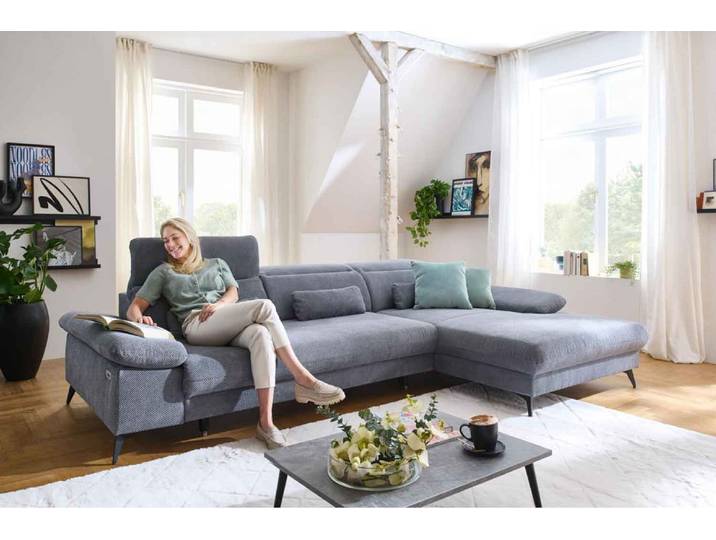 Ecksofa mit motorischen XL- Sitzvorzug in Stoff