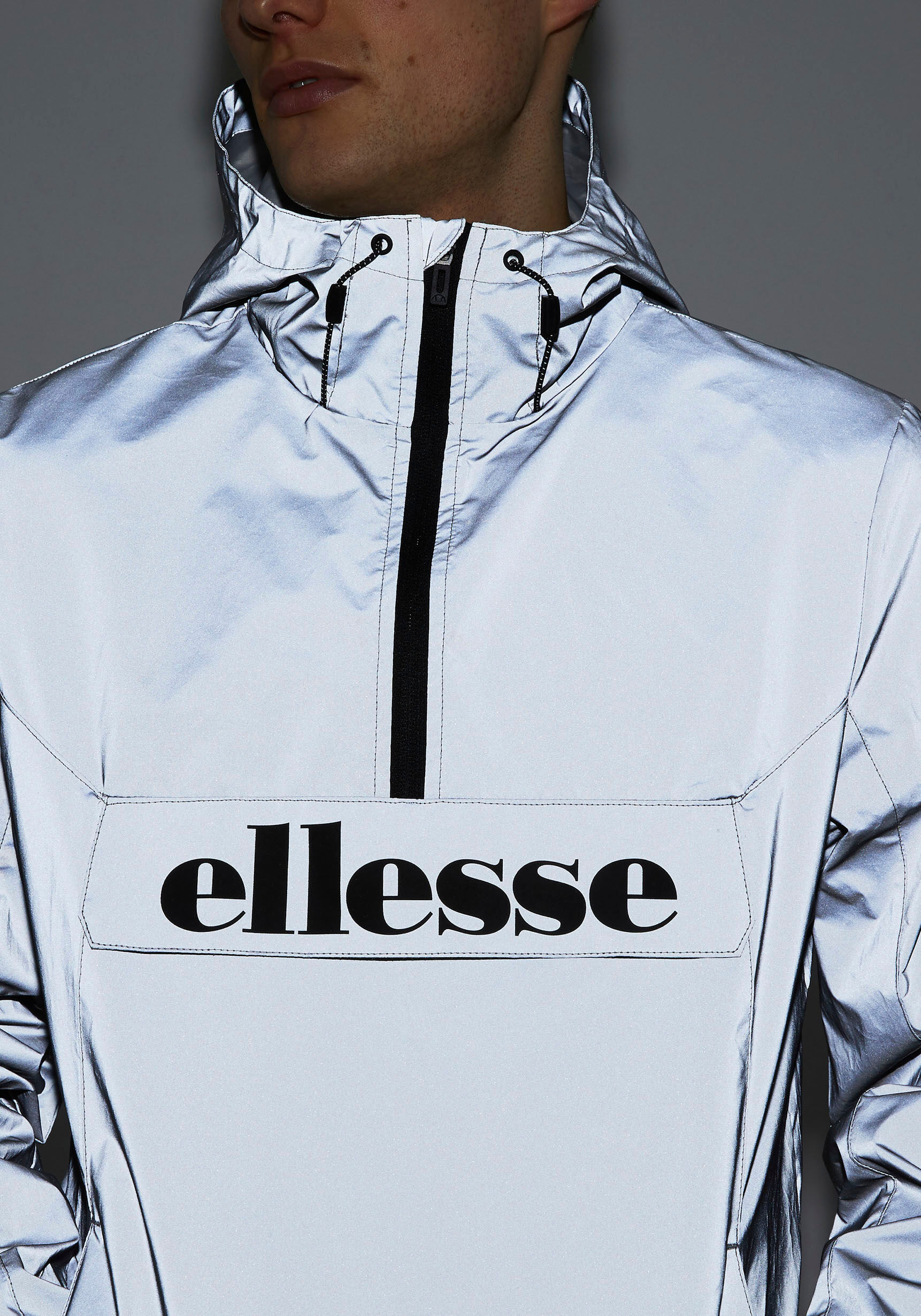 Windbreaker ELLESSE "ACERA OH JACKET", Herren, Gr. XS, grau (reflective), Obermaterial: 100% Nylon, Basic schmal hüftlang, hoch geschlossener Ausschnitt, Bündchen mit Gummizug, Jacken Windbreaker, Übergangsjacke, hüftlang, mit Kapuze reflective XS