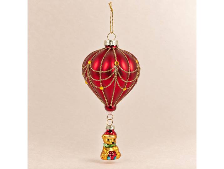 Weihnachtsschmuck aus mehrfarbigem Glas, der einen Heißluftballon und einen Teddybären zeigt.