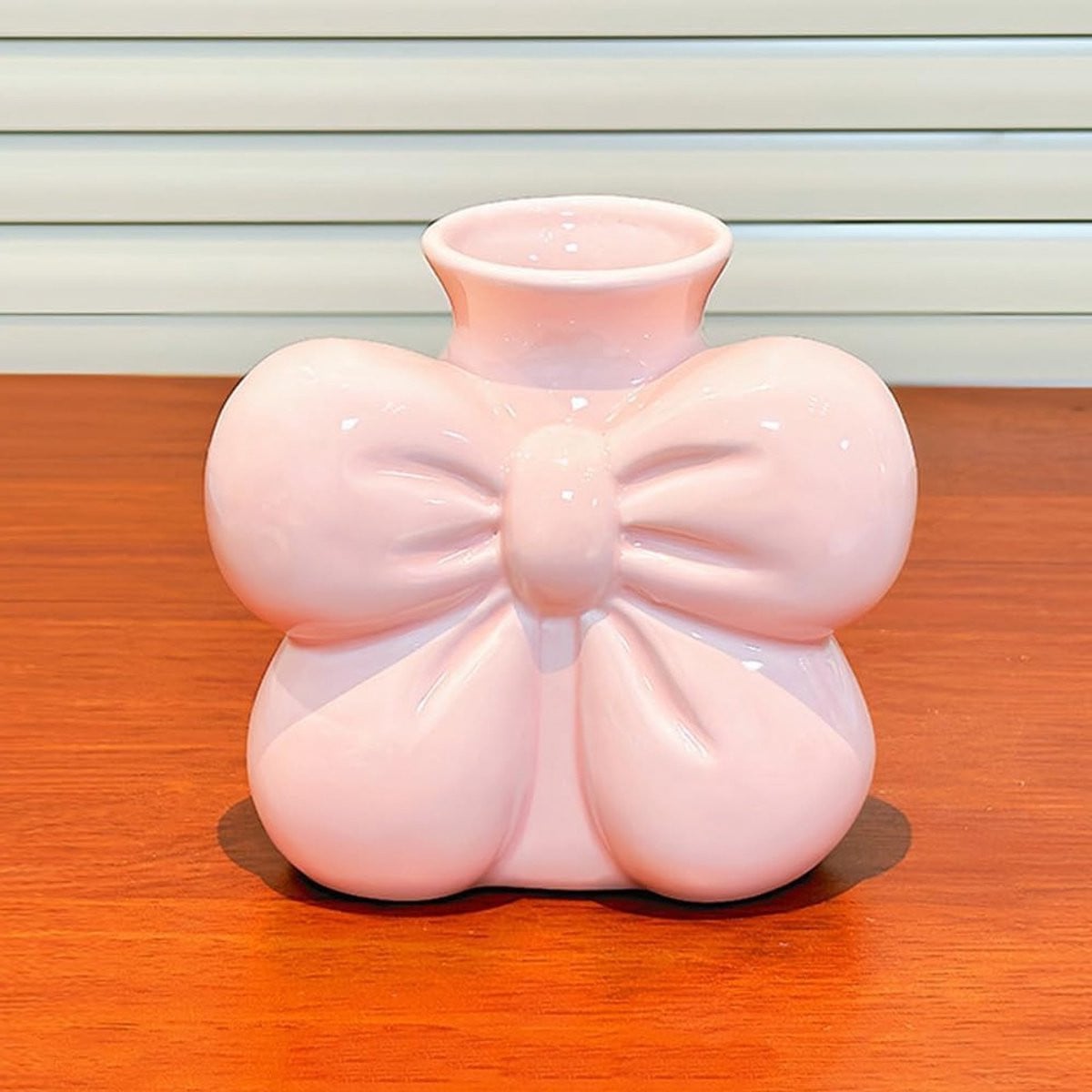 Elegante keramische boogvaas voor bloemen in roze