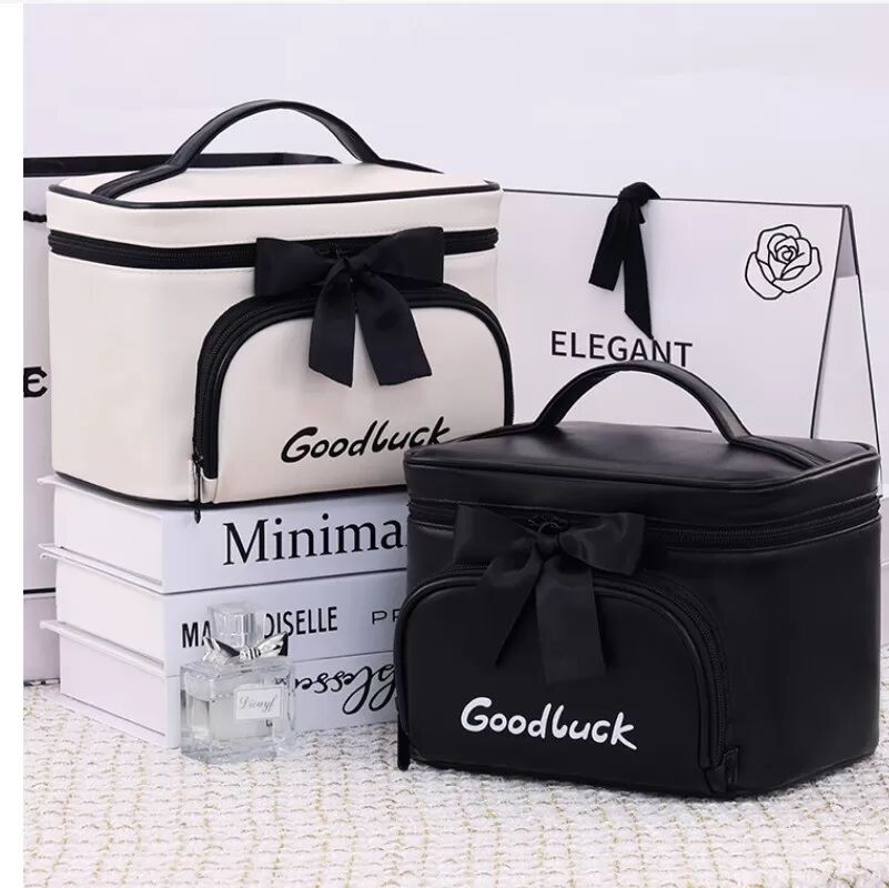 INF Schicke Kosmetik- und Kulturtasche mit Schleife - Tragbar & Stilvoll Schwarz