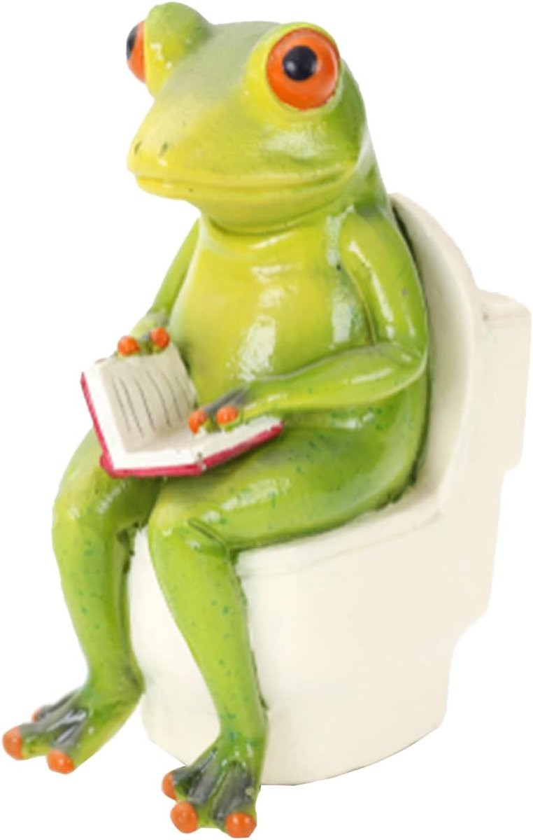 Grappig groen kikkerbeeldje zittend op het toilet voor decoratie in huis, kantoor of badkamer