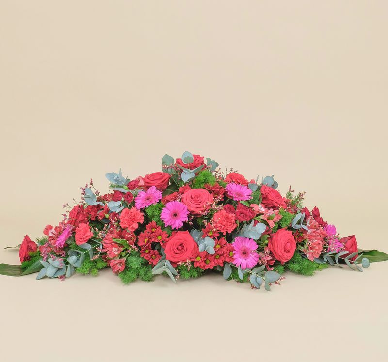 Raquette fleurs rouges : Symphonie sacrée, raquette florale - Interflora