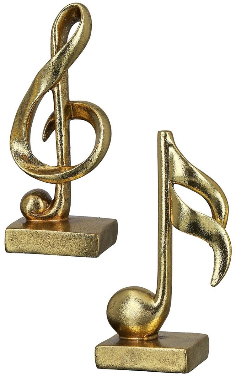 Gouden muzieknoot en muzieksleutel decoratie