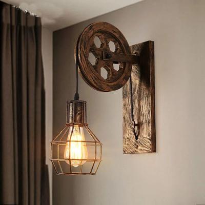 Uplifted Goods Vintage Industrial Lifting Pulley Wall Lamp For Timeless Home Decor bronze