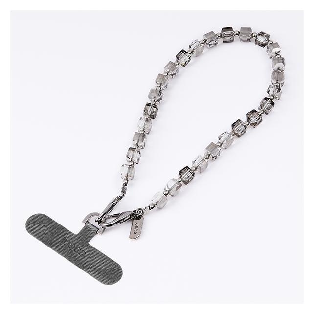 Uniq Coehl Candy Gem Handstrap uniwersalny sznurek do telefonu na rękę srebrny/silver spa (UNIQ)