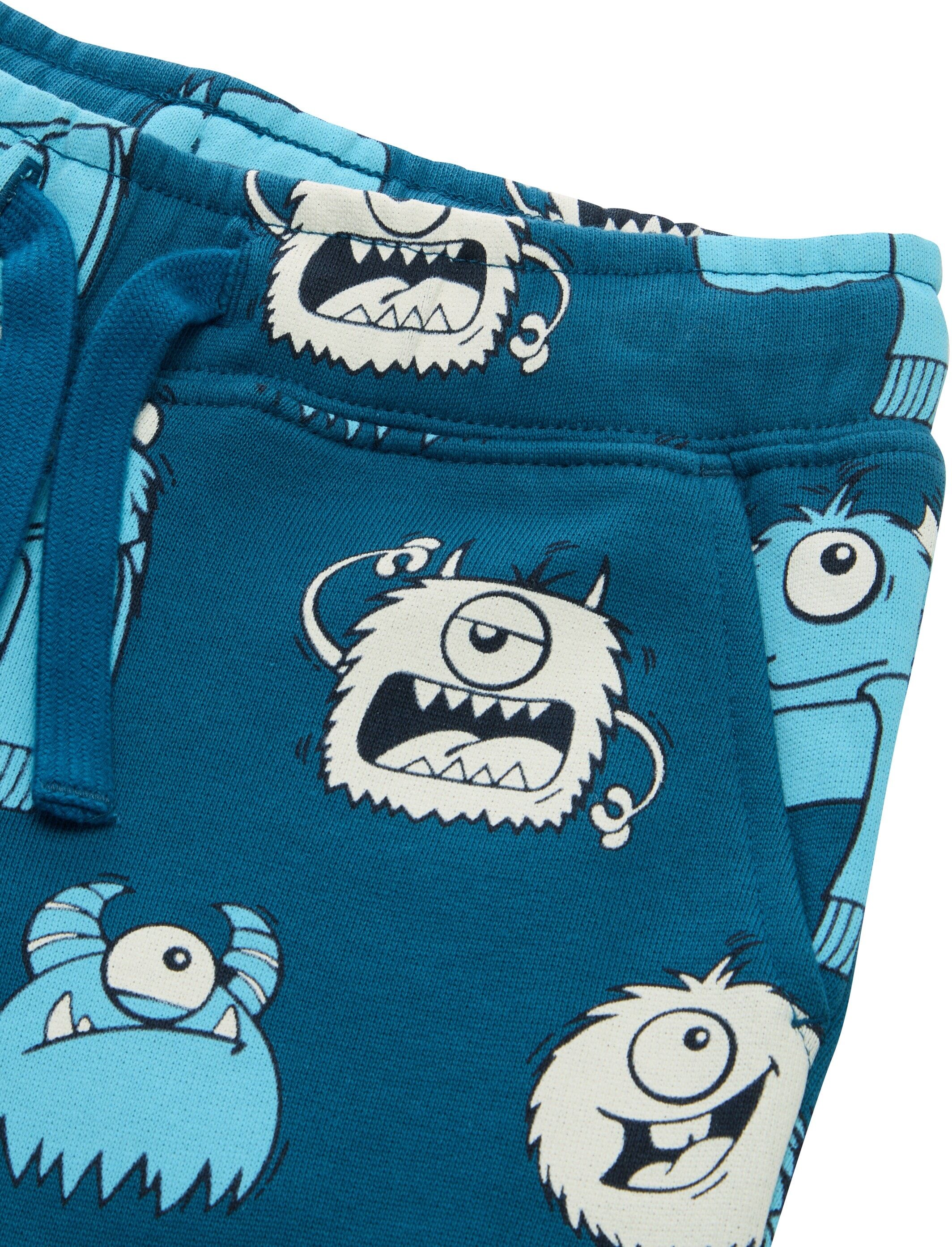 Jogginghose TOM TAILOR, Jungen, Gr. 128/134, N-Gr, blau (bluish cozy monster design), Web, Obermaterial: 100% Baumwolle. Futter: 100% Baumwolle, bedruckt, normal lang, Hosen Jogginghose, mit Allover-Monster-Prints bluish cozy monster design 128/134, N-Gr