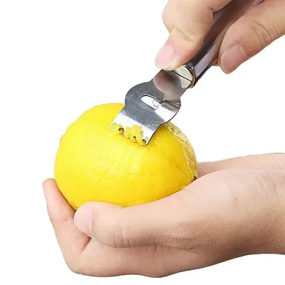 Stainless Steel Lemon Peeler & Citrus Zester For Effortless Fruit Preparation. Stainless Steel Lemon Peeler & Citrus Zester For Effortless Fruit Preparation.