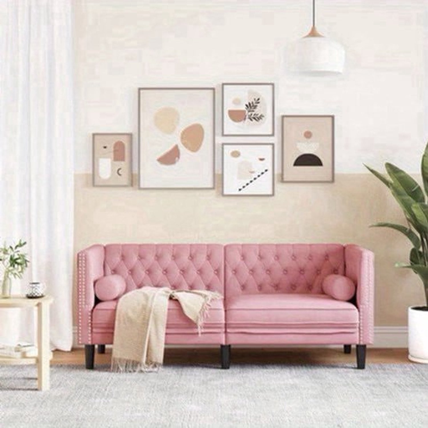 Chesterfield 2-zits bank in roze velvet met decoratieve kussens
