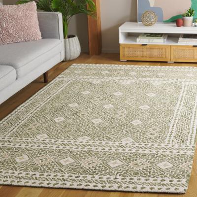 SAFAVIEH Handmade Micro-Loop Jelske Wool Rug