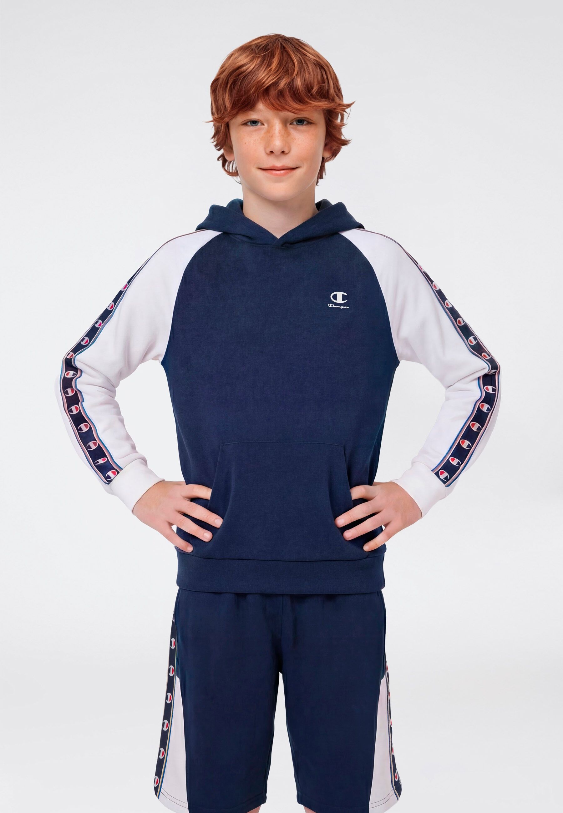 Kapuzensweatshirt CHAMPION "Sports-inspired Terry Hoodie with Tape detailing", Jungen, Gr. L (152/158), blau (nava, wht), angeraute Sweatware, Obermaterial: 73% Baumwolle, 27% Polyester, normal, angesetztes Bündchen, Sweatshirts Kapuzensweatshirt, für Kin