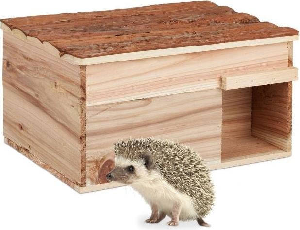 Das huisje met vloer voor in de tuin
